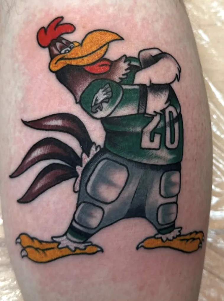 Cartoon rooster in Philadelphia Eagles football gear